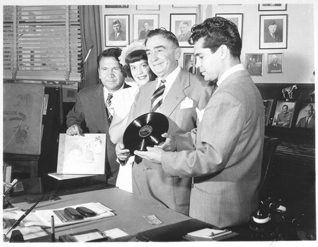 Don Ramon, Jada "Chartita" Martinez (Tosti's sister), Sheriff Eugene Bizcaluz & Don Tosti holding his first record.