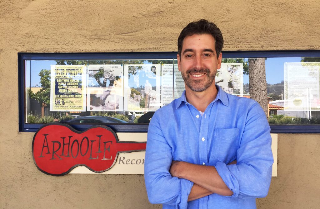 Adam Machado in front of Chris Strachwitz's Down Home Music Store in El Cerrito, CA